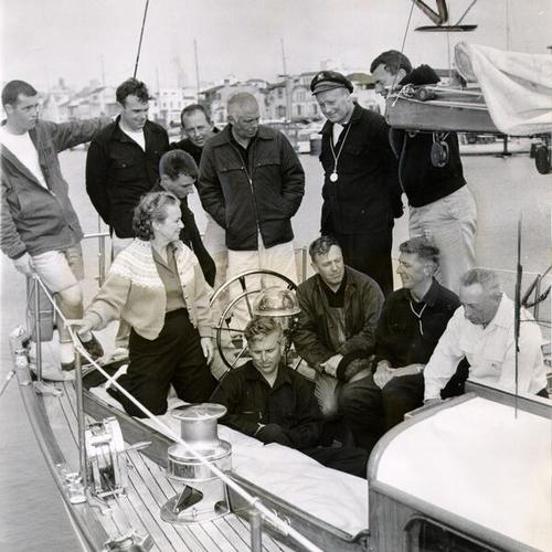 [Dorothy and Tim Moseley with the crew of the 63-foot cutter Orient at San Francisco Yacht Harbor]