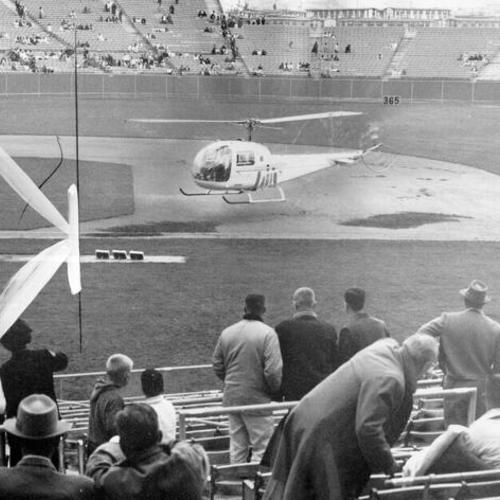 [Helicopter drying out basepaths with 30-foot roter blade on Candlestick Park's field]