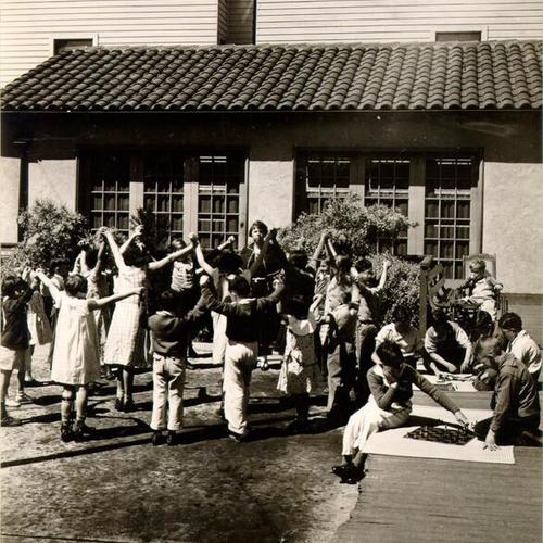 [Students and staff in the yard outside Sunshine Orthopedic School]
