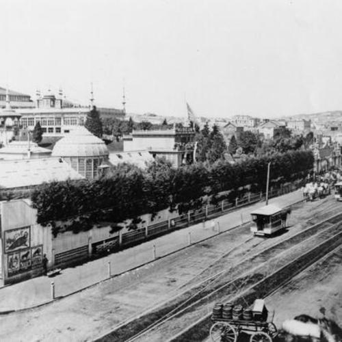 [View of Mission Street entrance of Woodward's Gardens with "bob cars", etc.]
