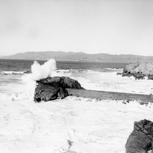 [Waves breaking on a large rock at Ocean Beach]