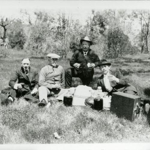 [Charlie's grandfather Charles and his friends at picnic in Hopland, Mendocino drinking bootleg wine]