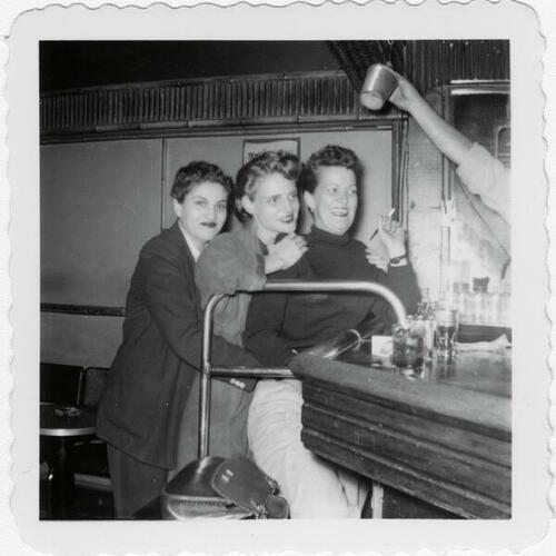 [Grace Miller, Joyce Van de Veer, and Jean Sullivan? at bar]