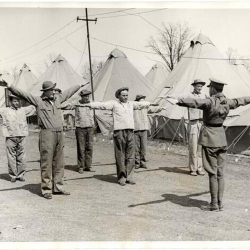 [Recruits to President Roosevelt's Conservation Corps going through exercises]