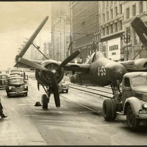 [Plane stuck in rut in front of the Emporium, on Market Street]