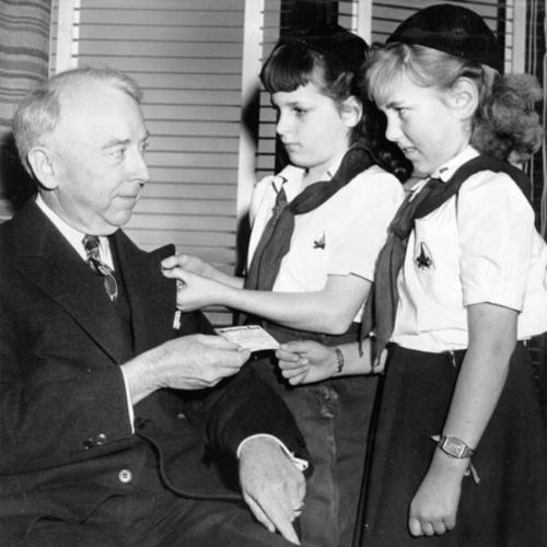 [Thomas A. Brooks, chief administrator officer, becomes an honorary Girl Scout]