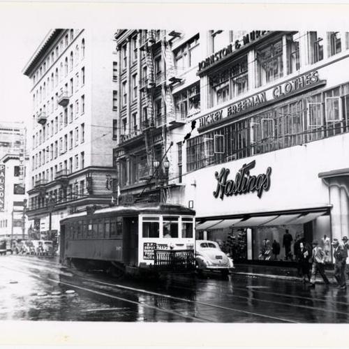 [Kearny near Post looking at Northbound #20 line car 297 passing Hastings department store]