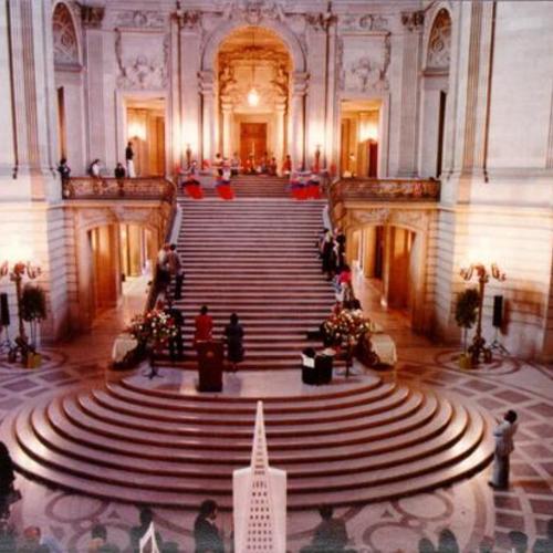 [Social event being held in the Rotunda of City Hall]