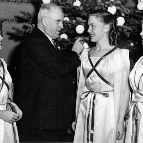 [San Francisco Bank president Parker S. Maddux with singers Eileen Christopher, Leona Oddstad and Patricia Butler]