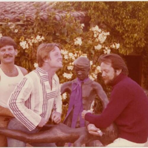 Ken Maley (left), Armistead Maupin (center), and Gary (right), with statue in swimming pool area at Rock Hudson's home, The Castle, Beverly Hills