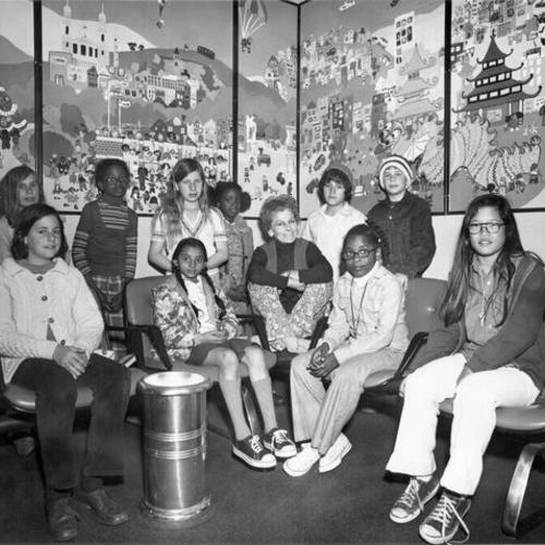 [Group of students and staff from Grattan School posing in front of a mural at U. C. Medical Center]