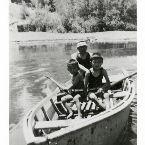 [Two brothers with uncle in row boat on trip to Russian River]