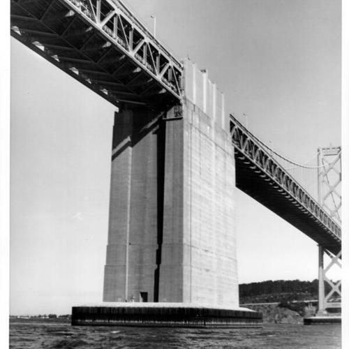 [Sea level view of San Francisco-Oakland Bay Bridge under construction]