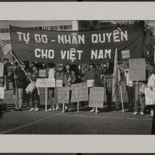 Vietnamese children and their parents protesting refugee camp conditions in Vietnam and Hong Kong