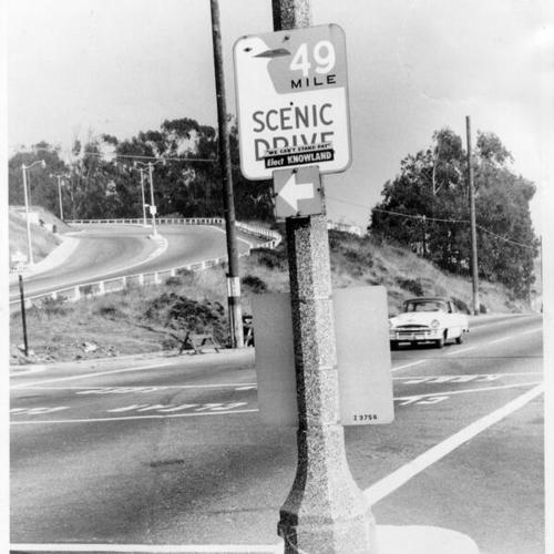[Political sign posted onto '49 Mile Scenic Drive' sign on Portola Drive]
