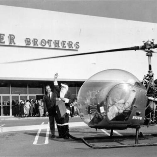 [Santa Claus arriving by helicopter at Butler Brothers department store at Stonestown Shopping Center]