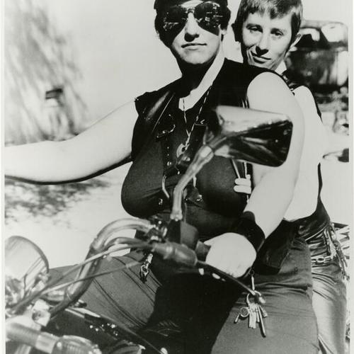 [Friends riding a motorcycle together]