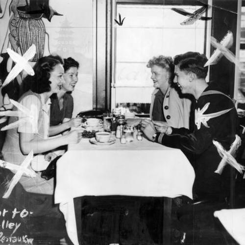 [Lynn Johnson, Edna Tunison, Esther Johnson and Ray Shroeder dining at the Mandarin Cafe, 966 Market Street]