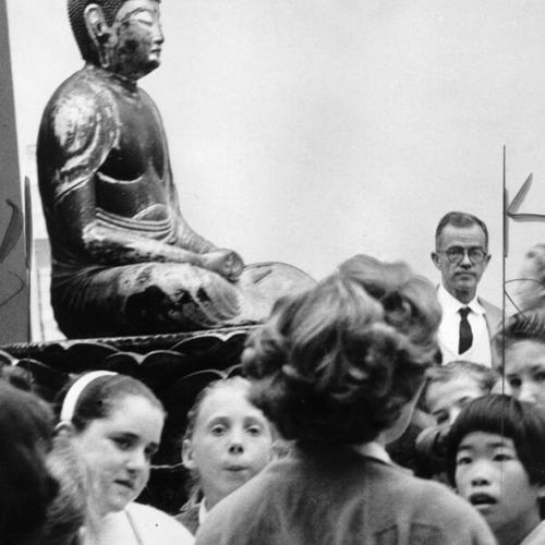 [Young people viewing a statue of Buddha during a visit to the De Young Museum in Golden Gate Park]