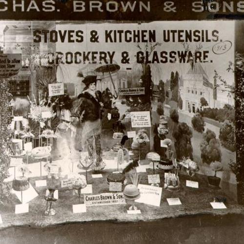 [1913 window display of Charles Brown and Sons hardware store]