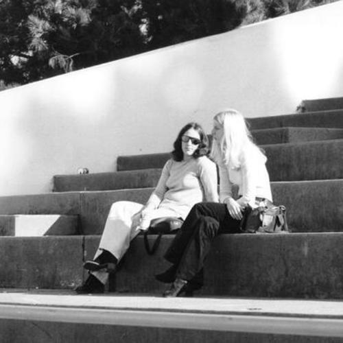 [Two women sit on steps in Aquatic Park]