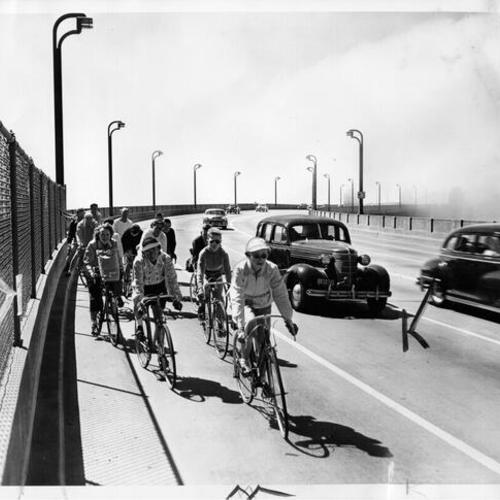  group of cyclists bicycling near the Marin shore]