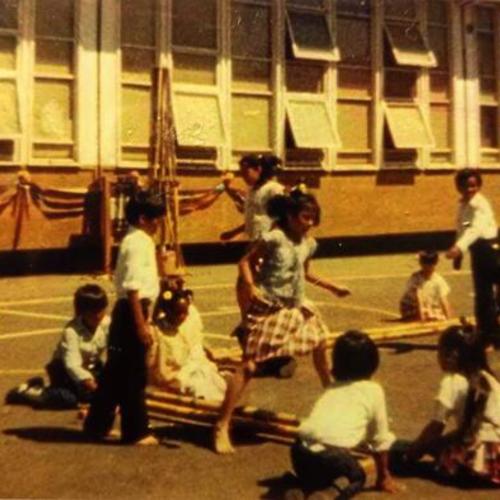 [John's younger sister Jennifer and her friends playing tinikling at courtyard at Bessie Carmichael School]