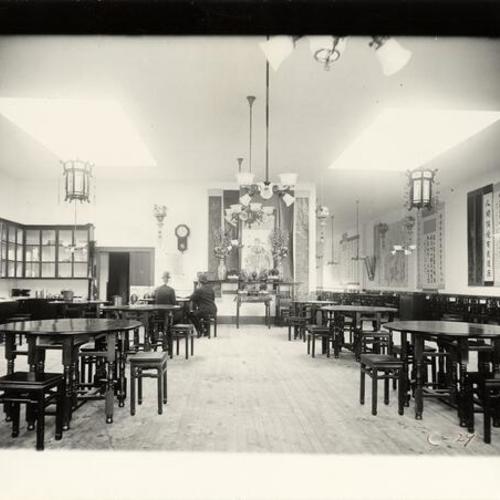 [Two men sitting inside Hing Far Low Restaurant on Grant Avenue in Chinatown]