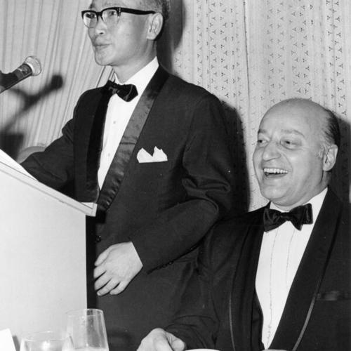 [Consulate General of Japan speaks at dinner; Joseph Alioto seated]