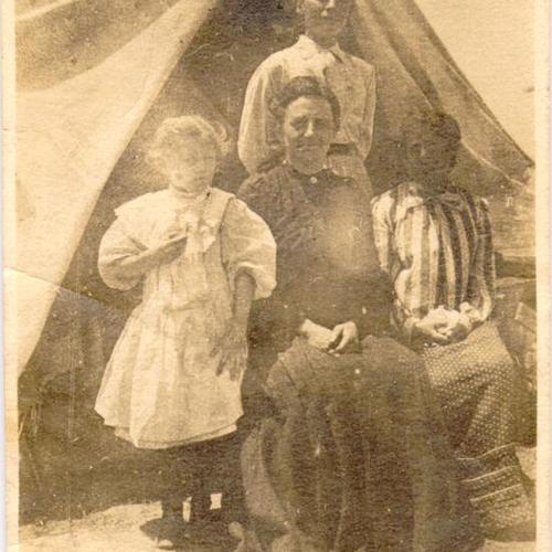[Mrs. Amelia Peters Bush, Mrs. Catherine Maria Peters, Irene Peters and an unidentified person posing for a picture at a refugee camp]