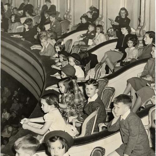 [Children watching a Young People's concert at the War Memorial Opera House]