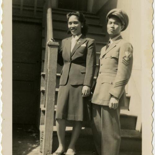 [Rosie and likely a friend of her dad in uniforms]