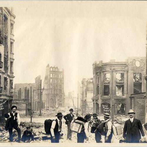 [Group of men standing near the ruins of the Tivoli Opera House at Ellis and Mason streets]