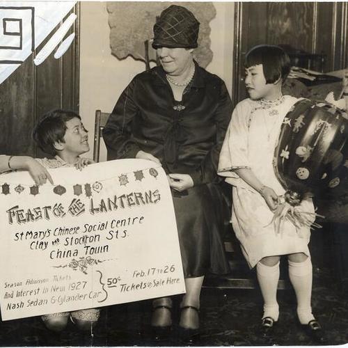 [Mrs. Elizabeth Hayes with two children at the Feast of the Lanterns Festival at St. Mary's Chinese Social Centre in Chinatown]