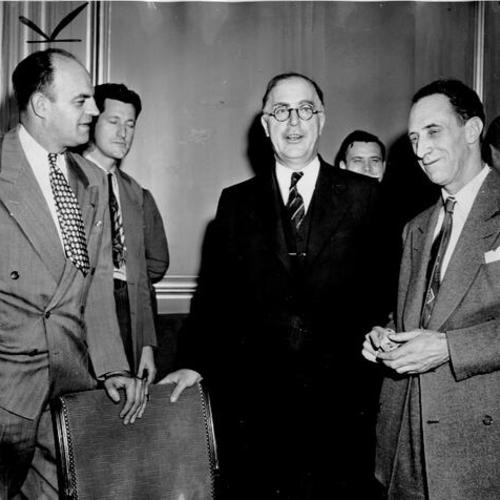 [Harry Bridges and Joseph Curran confers with Secretary of Labor Lewis B. Schwellenbach]