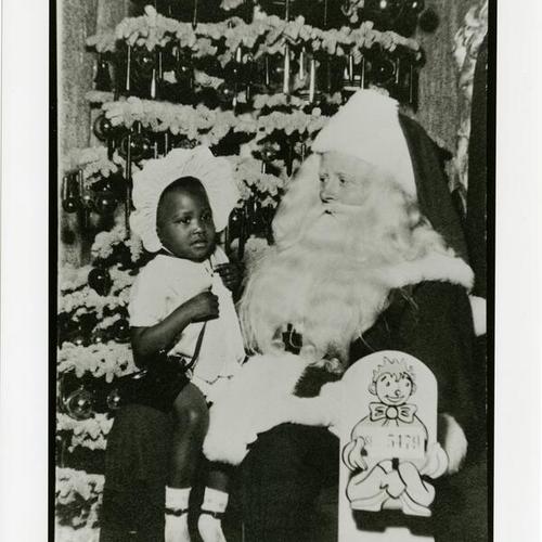 [Karen with Santa about 1948 at Emporium]