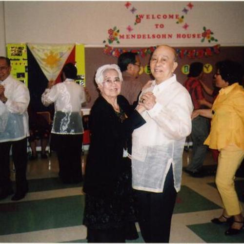 [Amparo and Jose dancing at the Mendelsohn House Senior Center]