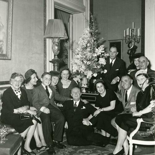 [Group portrait with Christain Dior in center, Miss Stella Hanania to his left and Hector Escobosa to her left]
