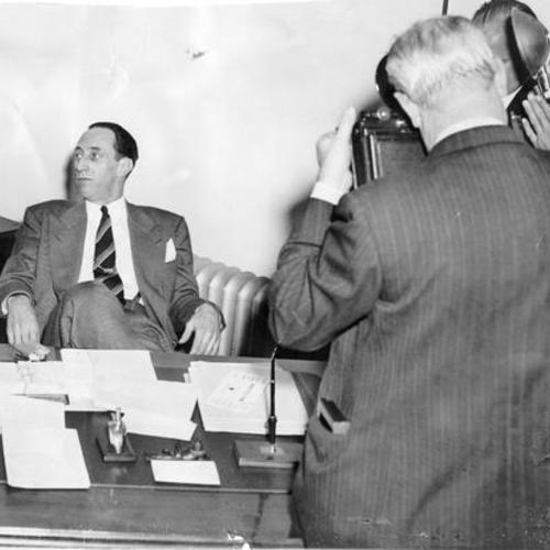 [Harry Bridges being photographed by the press]