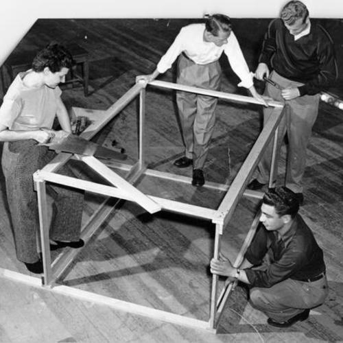[Sybil Siegel, Robert Lindsay, Edward Markmann and Ernest Venneri  working on the set of the Municipal Theater]