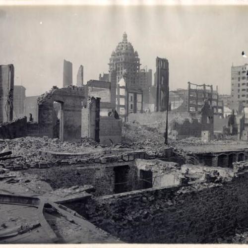 [Ruins in downtown area, with Call Building visible in center background]