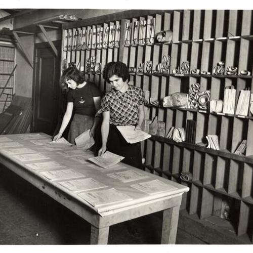 [Dorothy Ford and Arline Bowman working on book mending and filing project]
