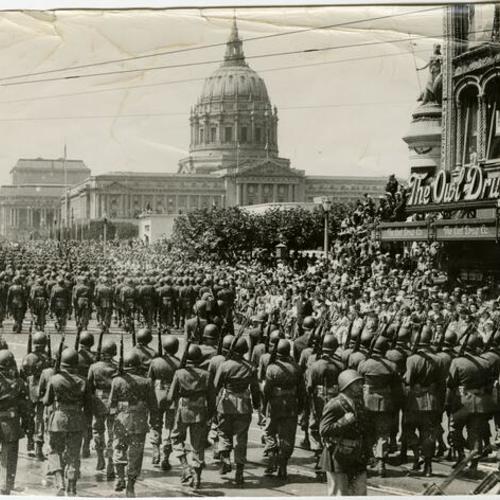 [United States Army troops parading toward City Hall]