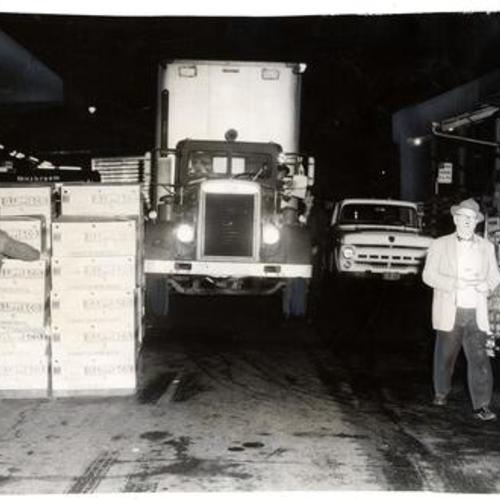 [Delivery trucks being unloaded at the old produce district in downtown San Francisco]