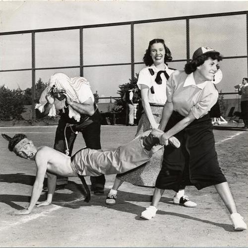 [Students Milt Chanbry, Winston Silva, Jacque Gagnon and Burley Halloran participating in "Sadie Hawkins Day" event at San Francisco State College]