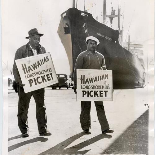 [Hawaiian longshoremen John Augai and Fred Kamhoahoa picketing at Pier 50A in San Francisco]