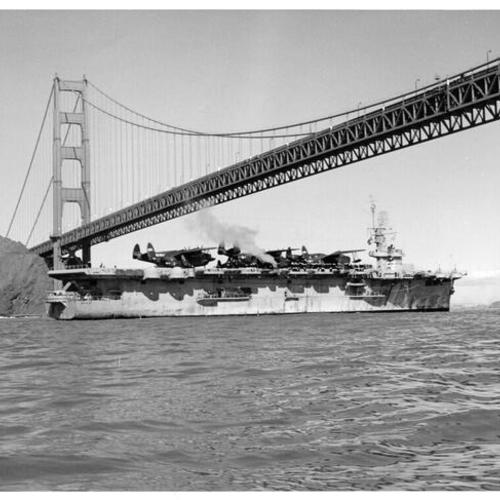 [USS Windham Bay passing underneath the Golden Gate Bridge]
