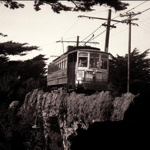 [Golden Gate Park Private Right of Way looking north at #7 line Market Street Railway car 156 crossing South drive on bridge]