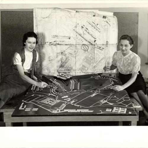 [Marguerite Barnett and Irene Palladini working on a scale model of the Presidio]