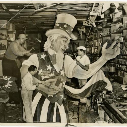 [Wallace Tot, M. V. Resella and Robert Yick working on an Uncle Sam float for a parade in honor of Madame Chiang Kai-Shek]